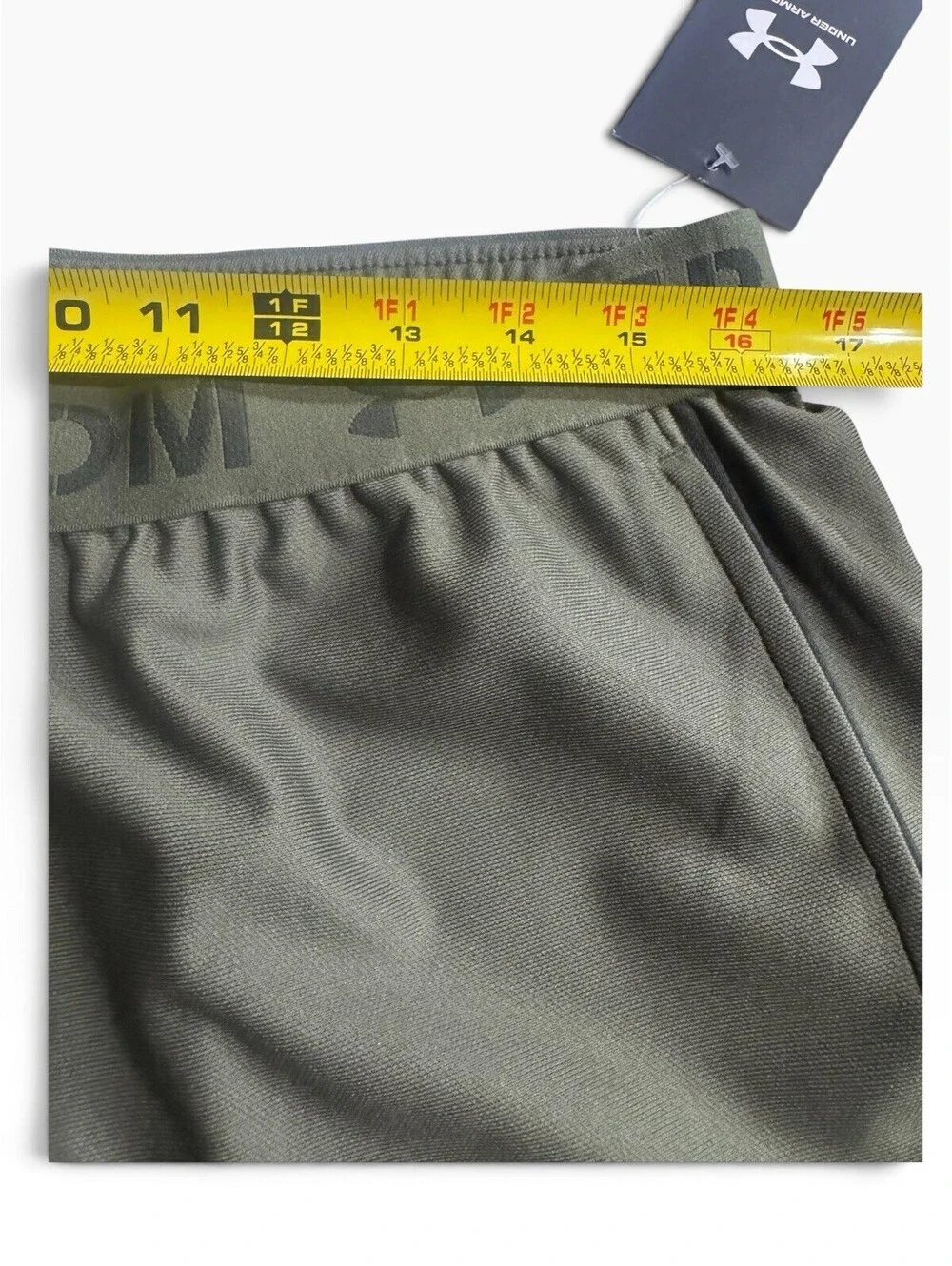 Under Armour Women's Freedom Play Up Shorts pockets green 3 in inseam size large